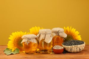 sunflowers and 3 jars of sunflower oil