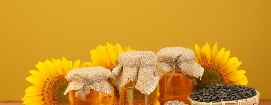 sunflowers and 3 jars of sunflower oil